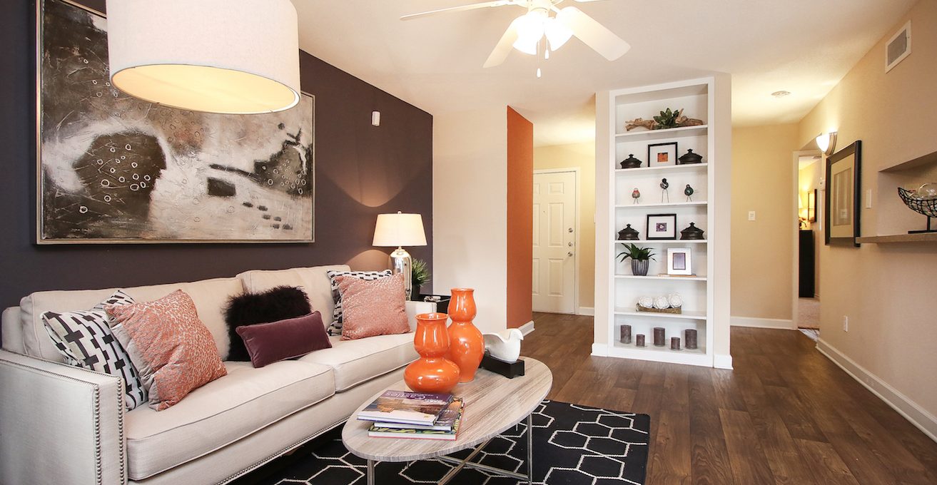 a living room with a white couch and a black coffee table at The Westmount at London Park
