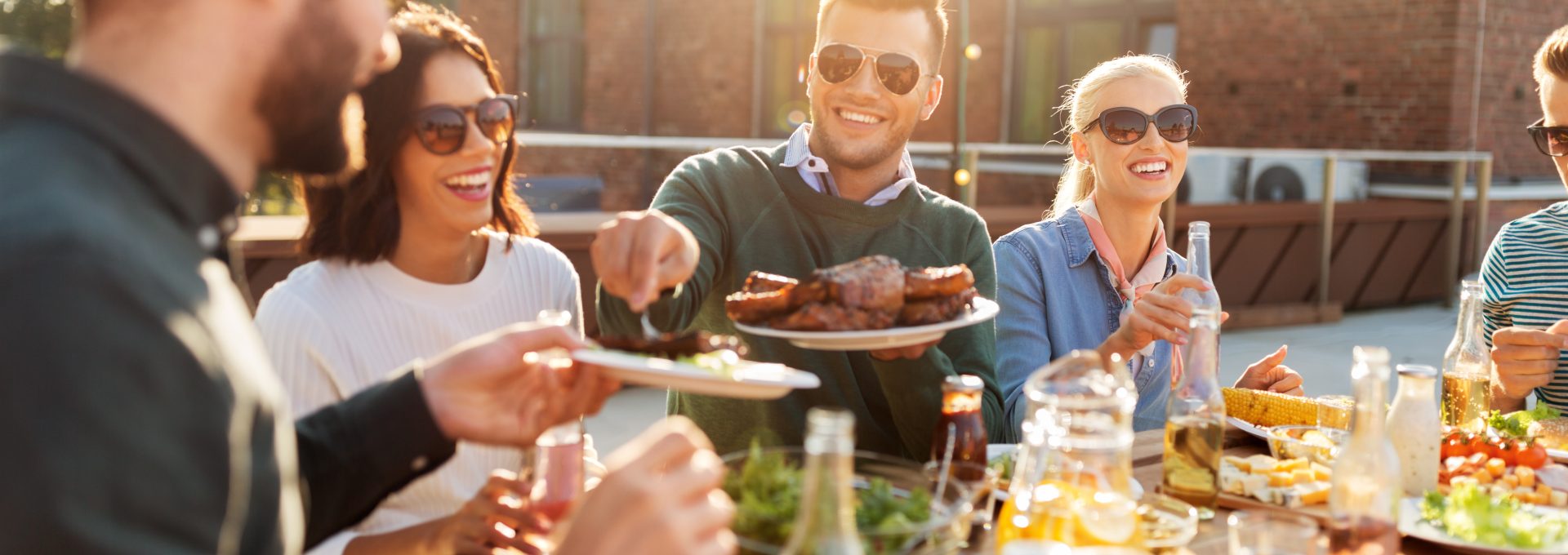 a group of people eating food outdoors at The Westmount at London Park