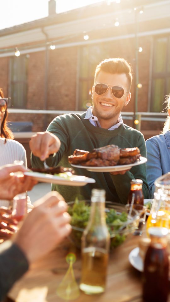 a group of people eating food outdoors at The Westmount at London Park