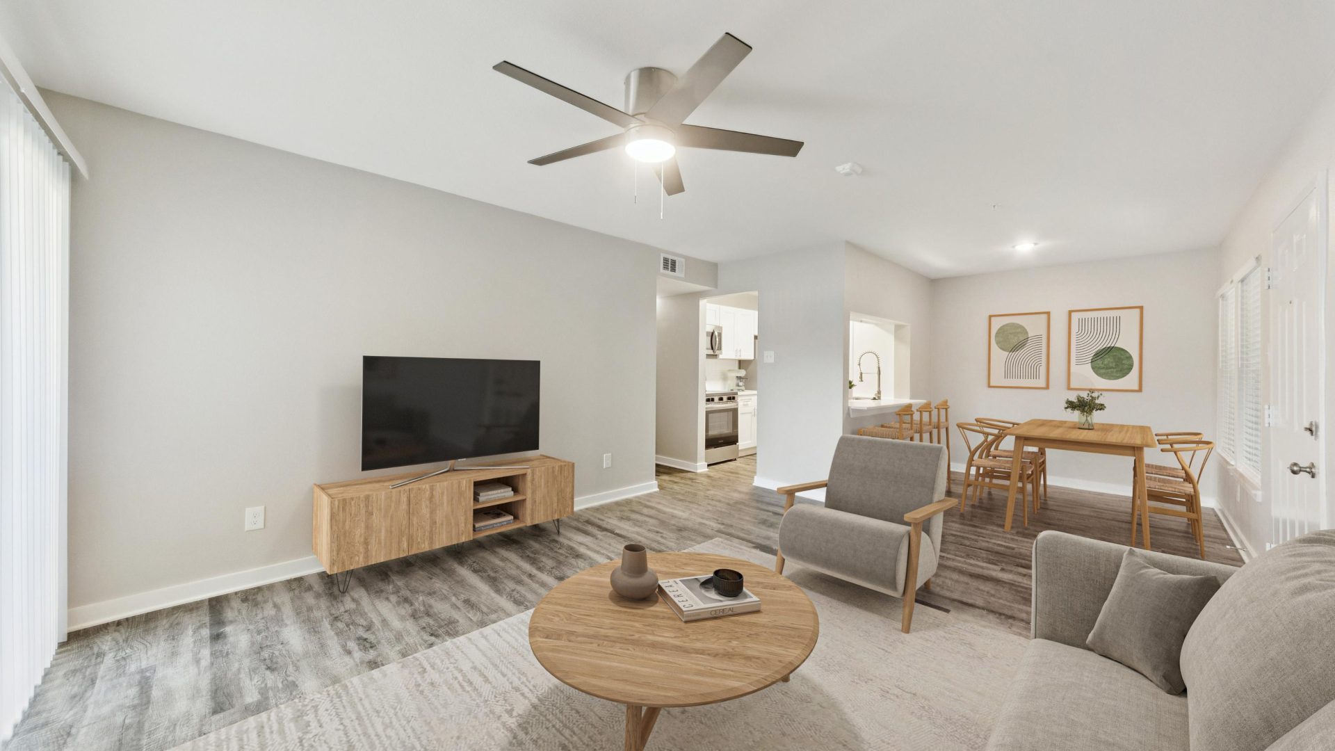 a living room with a ceiling fan and a couch at The Westmount at London Park