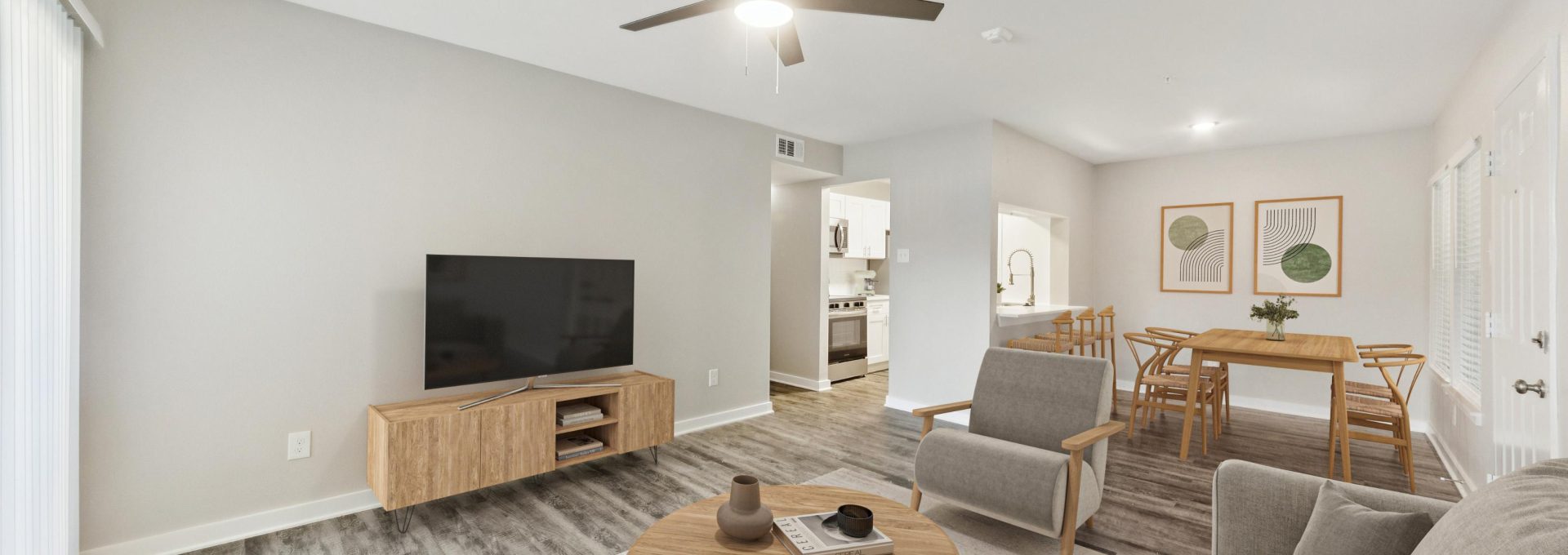 a living room with a ceiling fan and a couch at The Westmount at London Park